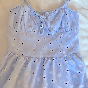 Baby blue dress with, white flower and darker blue in the middle of the flowers.